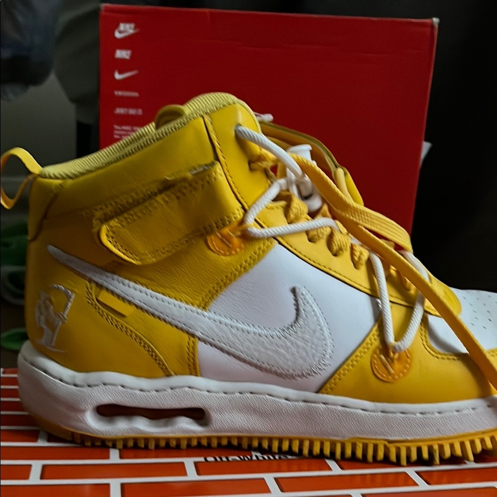 Nike Yellow Athletic Shoes with White Swoosh and Retro Style
